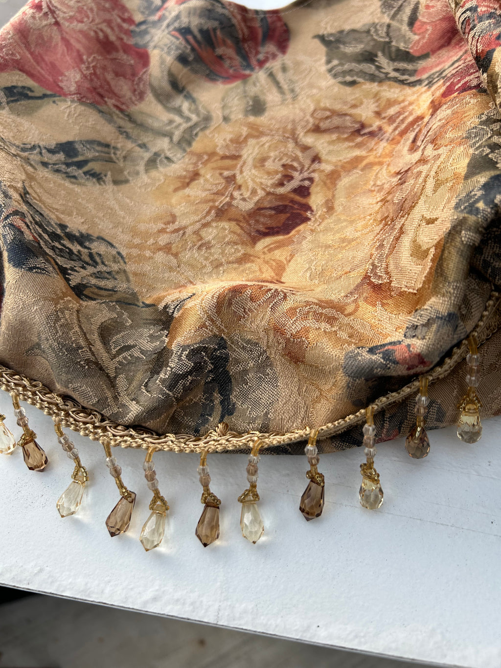 Brown floral tassel purse with crystal trim